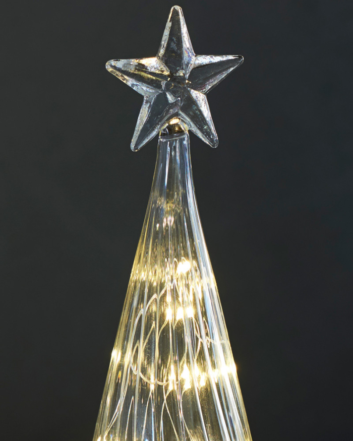 close up of glass star on top of glass tree